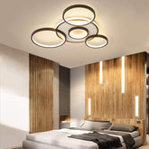 Modern bedroom with ceiling lights and wooden wall design