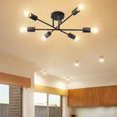 Modern black chandelier with multiple lights on a ceiling