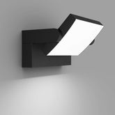 Modern black wall light fixture on a gray background