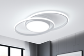 Modern ceiling light fixture in a room with neutral walls and a window.