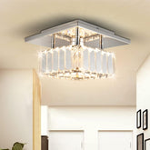 Modern ceiling light fixture in a room with neutral walls and minimal decor.