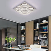 Modern ceiling light fixture in a stylish room with bookshelves and decor.