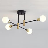 Modern ceiling light fixture with black and gold design on a gray background