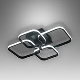 Modern ceiling light fixture with black and white design on a gray background