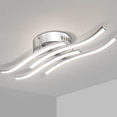 Modern ceiling light fixture with curved design on a neutral background