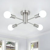 Modern ceiling light fixture with six spherical bulbs in a room with windows.