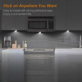 Modern kitchen with a microwave and stove, featuring text about adhesive tape.