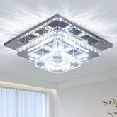 Modern square ceiling light fixture in a room with white walls and a window.