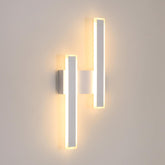 Modern wall-mounted light fixture on a plain wall