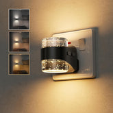 Modern wall-mounted light fixture with decorative glass cover on a textured wall.