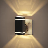 Modern wall-mounted light fixture on a neutral wall