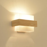 Modern wall light fixture on a beige wall
