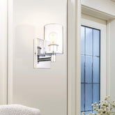 Modern wall sconce on a white wall with a window in the background