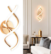 Modern wall sconce with gold and white design in a living room setting.