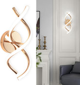 Modern wall sconce with gold finish in a stylish interior setting.