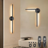 Modern wall sconces with adjustable arm on a beige wall, accompanied by remote controls.