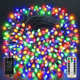 Multicolored string lights with control panel and remote on a dark background