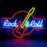 Neon sign of a guitar with 'Rock & Roll' text on a dark background