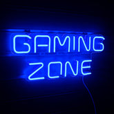 Neon sign with 'Gaming Zone' text on a dark background