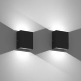 Cool white LED wall light in matte black on brick exterior