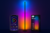 Smart floor lamp with smartphone app and packaging on a dark background