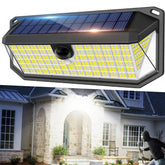 Solar-powered outdoor light fixture with a house in the background