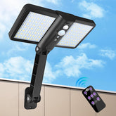 Solar flood light with remote control against a blue sky background