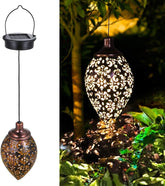 Solar hanging light with intricate design, shown in two views: on a white background and illuminated in a garden setting.