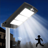 Solar street light with remote control on a dark blue sky background