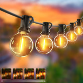 String of illuminated light bulbs against a blurred outdoor background