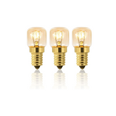 Three small vintage-style light bulbs with gold bases on a white background
