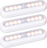 Three white LED motion sensor lights on a light gray background