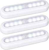 Three white LED motion sensor lights on a white background