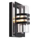 Black outdoor lantern wall light installed on brick exterior wall