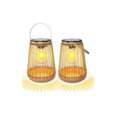 Two illuminated bamboo lanterns on a white background