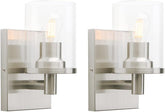 Two modern wall sconces with glass shades on a white background