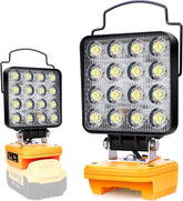 Two portable work lights with orange bases and black fixtures on a white background