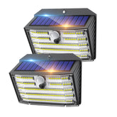 Two solar-powered outdoor lights with visible solar panels on a white background