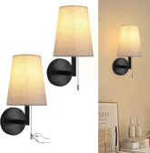 Two wall-mounted lamps with fabric shades on a white background.