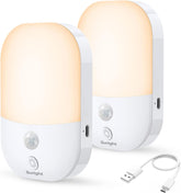 Two white night lights with motion sensors and USB cable on a white background