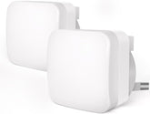 Two white power adapters on a white background