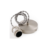 Metallic lamp holder with wiring on a white background