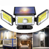 Solar-powered outdoor light fixture with motion sensor on a white background