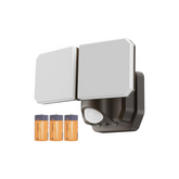 Outdoor security light with motion sensor and batteries on a white background