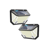 Two solar-powered outdoor lights on a white background