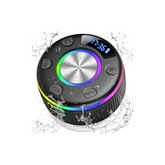 Black Bluetooth speaker with colorful display and buttons, surrounded by water droplets on a white background