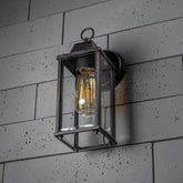 Vintage-style wall light fixture on a tiled wall