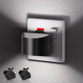 Wall-mounted light switch with night light feature on a textured wall.