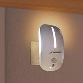 Wall-mounted night light with a visible brand logo on a neutral wall.