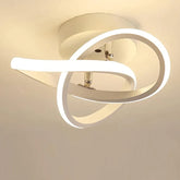 Modern ceiling light fixture with circular design on a plain background